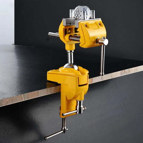 Badass Heavy Duty Cast Steel Bench Vise With Full 360 Swivel Ball Joint And Quick Grip Clamp Mount for workbenches, showing yellow finish.
