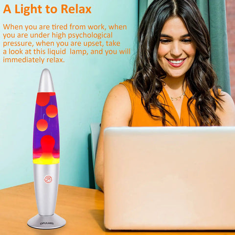 Woman working beside Dope Motion Lava Lamp 13.5 Inch With Silver Base, Orange Wax In Purple Liquid, Magma Style Nightlight For Adults
