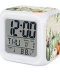Hella Durable Digital Alarm Clock With LED Night Light And Seven Color Modes Snooze Button Time Date Temperature Display Retro Cube Desk Clock For Bedroom Or Office Smooth As Butter Setup, showing digital display and pumpkin design.