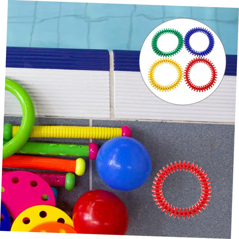 Colorful Soft Plastic Dive Rings For Pool Training And Safe Underwater Games, Four pack of water resistant dive gear by a pool.