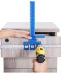 Pro Grade Cabinet Hardware Jig Kit Featuring Precision Drill Sleeves And Heavy Duty Mounting Template For Total Dead On Drawer Pull And Knob Installation Zero Sweat with a gauge on a wood drawer.