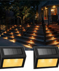 Level Up Your Deck Game With These Super Chill Non Glaring Warm White Solar Lights For Steps And Fences Featuring Tough Black Stainless Steel Housing Two Pack Outdoor Ambient Lighting on illuminated steps.