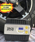 Slick And Dead Simple 12 Volt Portable Tire Inflator With Auto Shut Off And High Precision Digital Gauge next to a car tire.