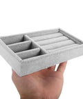 Keep Your Daily Bling Neatly Stashed In This Slick Gray Velvet Jewelry Organizer Tray With Elastic Grid For Rings Earrings Necklaces Watches Glasses Totally Solid For Home Or Store Display, held in hand.