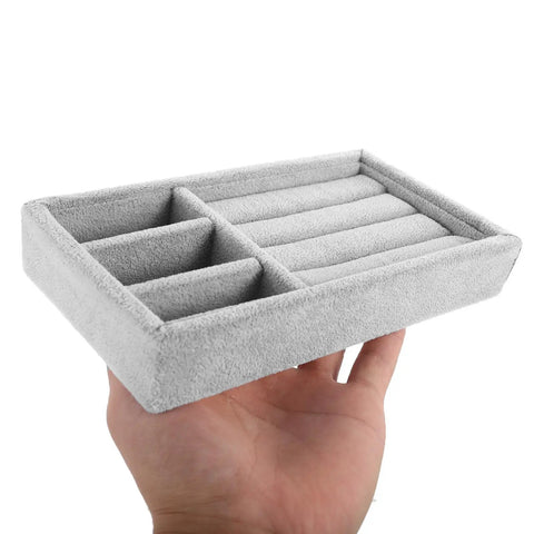 Keep Your Daily Bling Neatly Stashed In This Slick Gray Velvet Jewelry Organizer Tray With Elastic Grid For Rings Earrings Necklaces Watches Glasses Totally Solid For Home Or Store Display, held in hand.