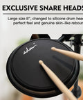 Close-up of 8-inch silicone snare head with drumsticks from Beginner Electric Drum Set With Quiet Mesh Pads And 180 Plus Sounds