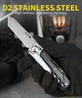 Gloved hand holding 7 In 1 Detachable Multitool with D2 Steel Blade and Large Scissors, showcasing its robust build.