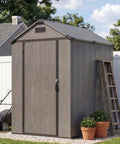 4x6 Foot Plastic Outdoor Storage Shed With Floor Lockable Door Vents UV Resistant Resin Durable Backyard Garden Shed For Lawn Mower And Gear Dark Grey in backyard setting