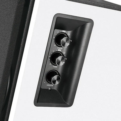 Close-up of control knobs on R1700BT Bluetooth Bookshelf Speakers with 66W RMS Power, white wood enclosure, treble, bass, volume