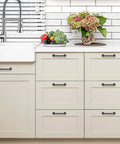 Solid 5 Inch Square Arch Cabinet Pulls Matte Black 30 Pack installed on white kitchen drawers