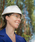 Person wearing clear safety glasses for work and lab unisex 24 pack bulk protective eyewear ANSI Z87.1 polycarbonate impact resistant