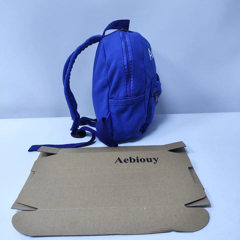 Side view of the Lightweight Daypack For Hiking And Camping In Bold Blue 11 By 9 By 10 Inches Trail Ready on white surface