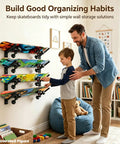 Man and child organizing skateboards on Four Layer Horizontal Skateboard Wall Mount Rack For All Boards And Sizes Boss Wall Storage Organizer.