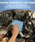 Hella Absorbent Heavy Duty Cleaning Cloths Jumbo Roll In Royal Blue being used on engine parts to remove grime.