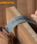 Hands using Pro Grade Emery Cloth Sandpaper Roll 120 Grit 1.5 In X 10 Yards Aluminum Oxide Abrasive on wooden block.