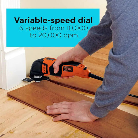 Person using Powerful Oscillating Multi Tool Workhorse With 2.5 Amp Motor And Variable Speed Dial from 10,000 to 20,000 OPM for cutting wood