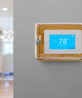 Lockable XL Air Conditioning Thermostat Cover Box With Key Clear Plastic Wall Mount on grey wall showing 78 degrees.
