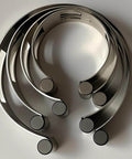 Stainless Steel Exhaust Tack Welding Clamp-On Kit For 2 Inch, 2.5 Inch, 3 Inch, And 3.5 Inch Pipes, four-piece set arranged.