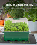 Elevated Seed Starter Kit with Grow Light and Adjustable Humidity Dome on heat mat, seedlings visible, home greenhouse setting