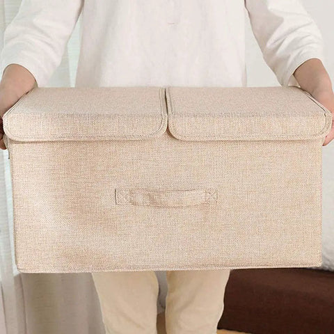 Nifty Collapsible Linen Fabric Storage Basket With Sturdy Foldable Design For Clothes Toys Shoes Books Towels And Magazines Sweet Home Organization Setup held by a person.