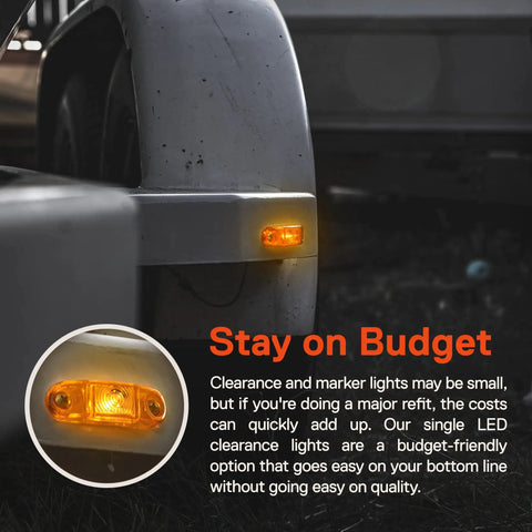 Close-up of Amber LED Trailer Marker Light Kit 4 Piece 2.5 Inch Waterproof IP67 on trailer fender in dark setting