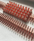 High Performance Red Copper Extended Plasma Cutter Tips And Electrode Consumable Kit For PT31 LG40 40A Torch arranged in rows for cutting.