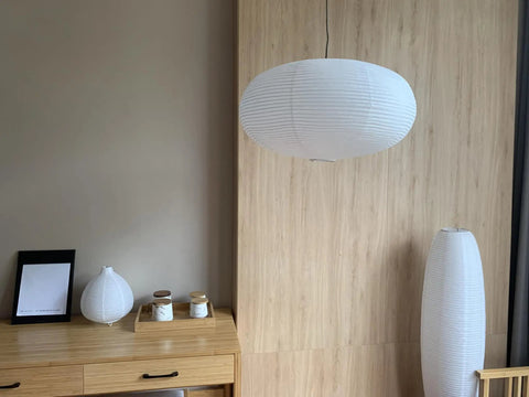 Large White Chinese Paper Ceiling Lamp Shade And Oval Pendant Light Cover With Vintage Round Chandelier Lantern Design in a modern room.