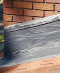 Brushable Black Elastomeric Chimney Flashing Sealant For Waterproof Leak Protection Around Chimneys, Vents And Skylights, Flexible And Stays Flexible Coating That Bonds To Shingles And Bricks And More In A Half Gallon applied on chimney.