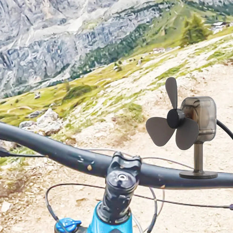 Portable Wind Turbine Generator For Camping And Hiking Mini Wind Power Charger With USB Output on a bike handlebar