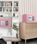 Electronic Digital Safe Box 0.23 Cubic Feet With Keypad Lock Pry-Resistant, pink finish, shown in home settings on shelf and dresser.