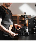 Person using Hit Your Sweet Spot With This Heavy Duty Wdt Needle Distributor for 58mm Espresso Portafilters in cafe.