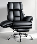 Big And Tall Leather Office Chair For Heavy Duty Comfort, 400 lb capacity, flip armrests, and footrest in black.