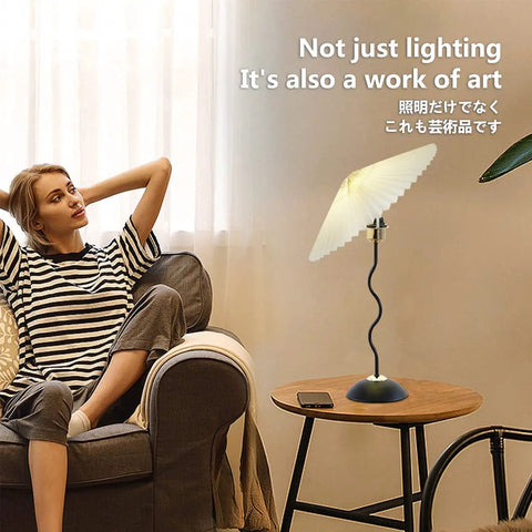 Harp Folding Lamp Set Two Pieces, Modern Umbrella Pleated Desk Lamp With White Shade on table next to relaxed woman