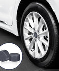 Heavy Duty 4 Pack 1.98 Inch Grey Rubber Bearing Dust Caps For Boat And Trailer Wheels Hub Grease Caps shown near car tire