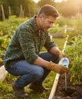 Man using 6-In-1 Soil Tester With 3 Probes For Moisture, pH, Fertility, Temperature, Light And Air Humidity in garden bed
