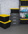 4 Pack 27 Gallon Heavy Duty Industrial Storage Tote With Lids in garage setting, black and yellow stackable bins on shelves