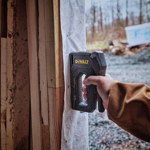 Using Carbon Fiber Body Workhorse 2 In 1 Staple Gun Tacker for heavy duty staples and 18 gauge brads on construction site