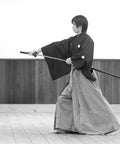 Samurai in traditional clothing practicing with katana, close view of Adjustable Katana Sword Belt Holder With Dual Buckles Dope PU Leather Samurai