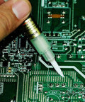 Applying Bon-102 Flux Paste Solder Pen With Soft Brush Tip For Precise Welding And PCB Work on a circuit board