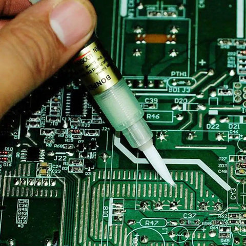 Applying Bon-102 Flux Paste Solder Pen With Soft Brush Tip For Precise Welding And PCB Work on a circuit board