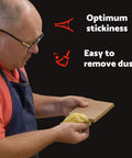 Person cleaning wood with Pro Grade Paint Prep Tack Cloth Kit for Woodworking and Auto Painting, Sticky Anti Static Dust Rags.