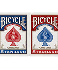 Standard Two Pack Playing Cards In Red And Blue Optimized For Tight Fan And Buttery Smooth Shuffle Heavy Duty Stock Built Like A Tank For Relaxed Handling During Cash Games And Tabletop Hangouts, displayed in boxes.