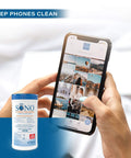 Person holding phone with Alcohol-Free Disinfecting Wipes No Bleach Medical-Grade Multi-Surface Cleaning For Home Office School Hospital Gym Gentle On Electronics 80 Count canister