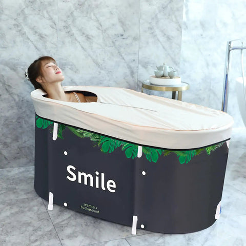 Person relaxing in Foldable Portable Bathtub For Small Bathrooms And Shower Stalls Eco Friendly Soaking Tub With Thermal Foam Keeps Water Warm No Fuss Setup Thick Insulation Easy Drain Whale Blue