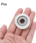 Buttery Smooth Rolls No Sweat Setup Heavy Duty Nylon Bearing Pulleys 10X35X11mm nylon idler pulley in hand, 4 pack.