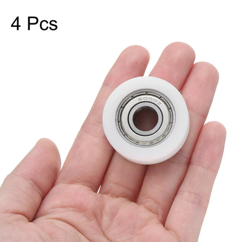 Buttery Smooth Rolls No Sweat Setup Heavy Duty Nylon Bearing Pulleys 10X35X11mm nylon idler pulley in hand, 4 pack.