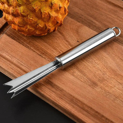 Pineapple Eye Remover And Core Cutter Tool V Shaped Stainless Steel Kitchen Gadget on a wooden board