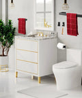 Rustproof 5 Piece Bathroom Hardware Set In Brushed Gold Stainless Steel SUS304 Includes 16 Inch Hand Towel Bar Towel Rack And Toilet Paper Holder And Three Robe Hooks in modern bathroom. Product shown on wall.
