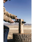 Person using Camp 10 Machete 10 Inch Recurve Fixed Blade on log outdoors