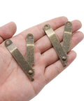 4 Pack Small Antique Brass Folding Lid Support Hinges for Wooden Boxes Jewelry Cases and Chests, held in hand for scale.